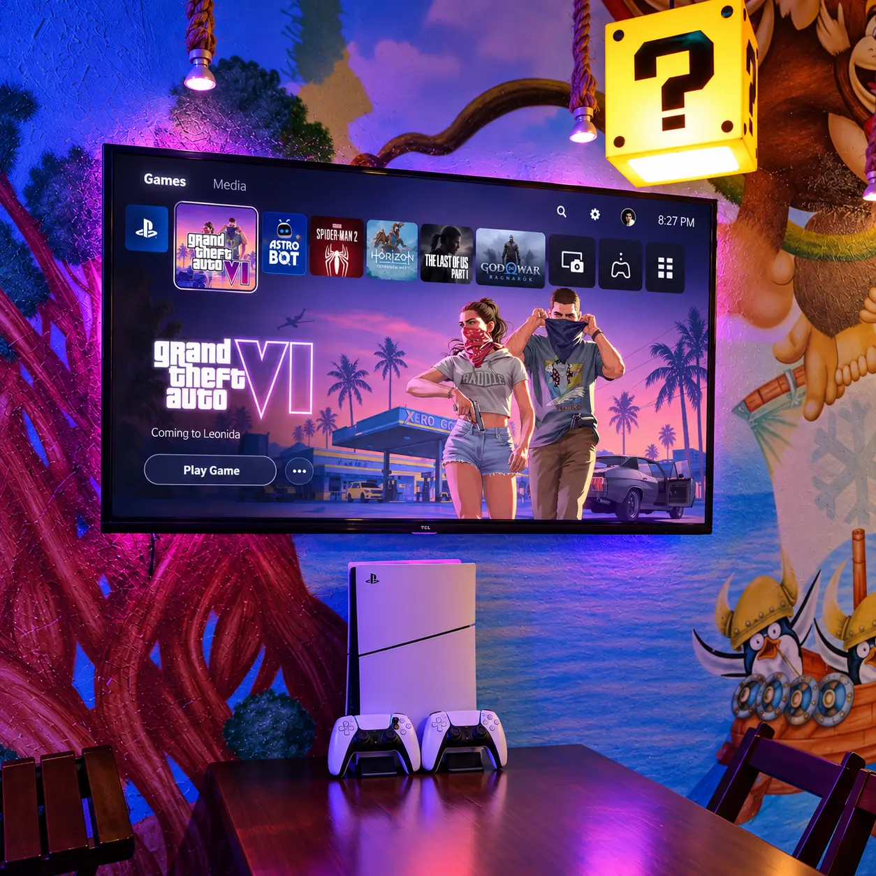 Mesa Burger Bits preparada com PlayStation 5 e jogo selecionado